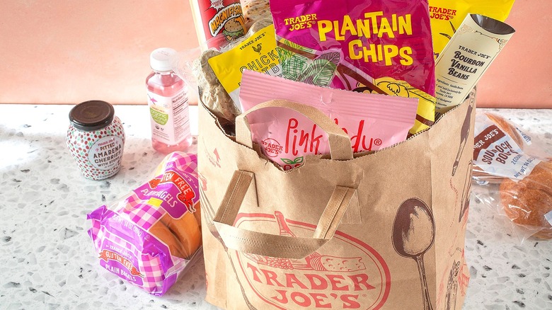 Brown shopping bag filled with Trader Joe's food products