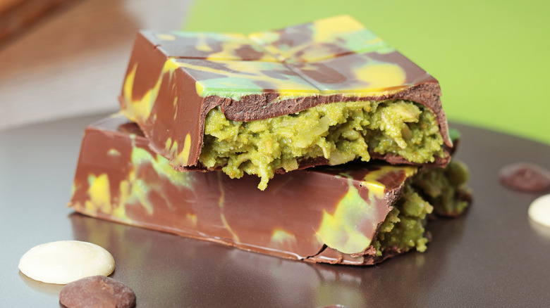 a thick slab of Dubai chocolate with a green marbled effect on the chocolate itself