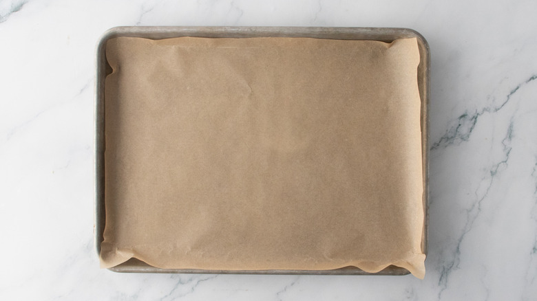 A medium-sized baking sheet lined with parchment paper.
