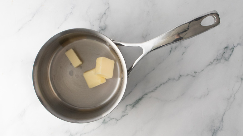 Tablespoons of butter in a small saucepan