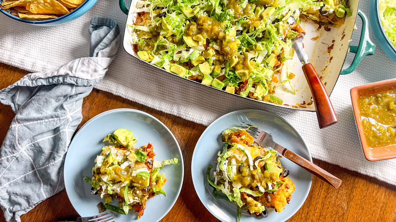 Loaded beef taco casserole on plates and in pan