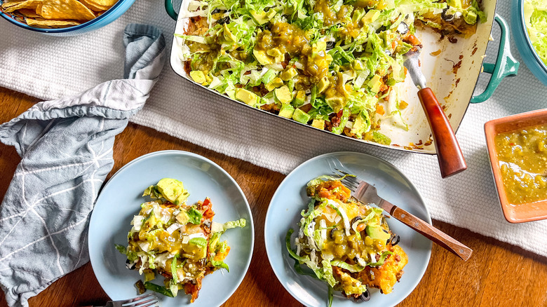 Loaded beef taco casserole on plates and in pan