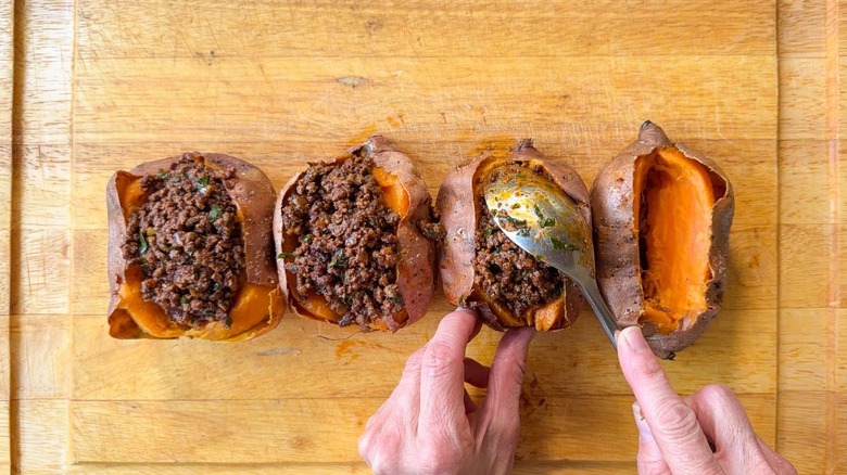 Stuffing baked sweet potatoes with ras el hanout beef
