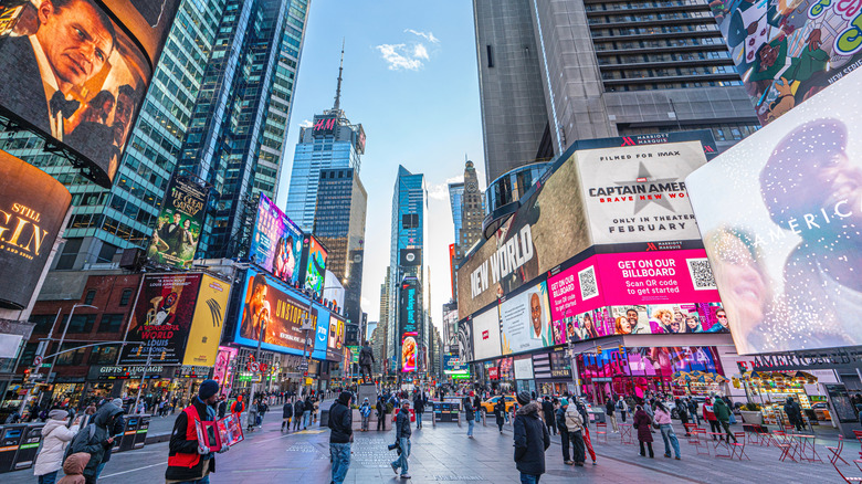 NYC's Times Square is packed with billboards and buildings.