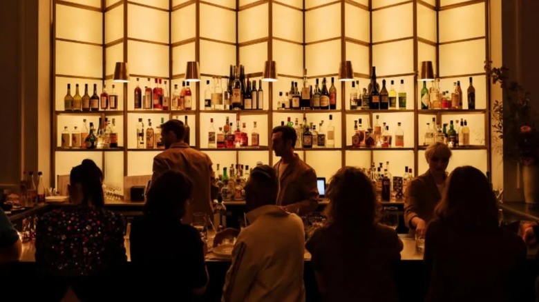The beautiful, backlit bar at Le Rock in NYC.