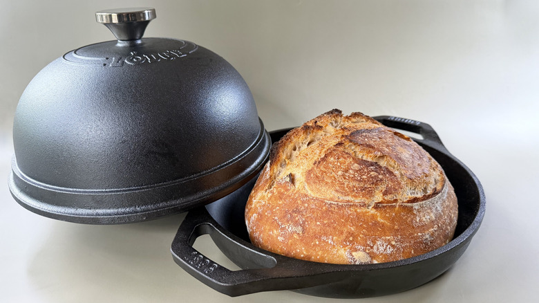 A boule of sourdough in a Lodge Cast Iron Bread Oven