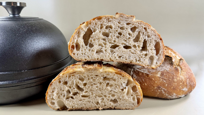 Sliced sourdough next to the Lodge Cast Iron Bread Oven