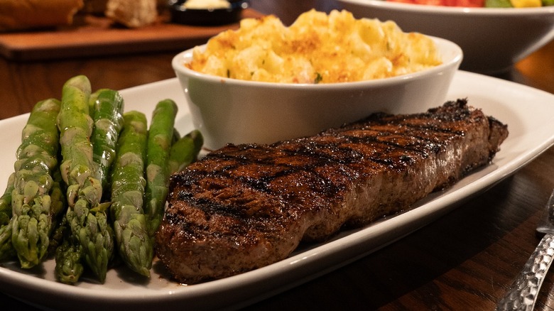 Steak, macaroni and cheese, and asparagus at Longhorn Steakhouse