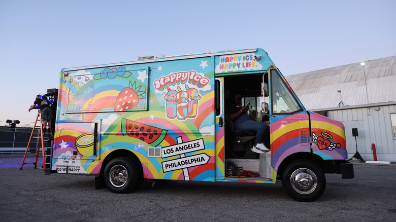 The Happy Ice truck parked in a parking lot
