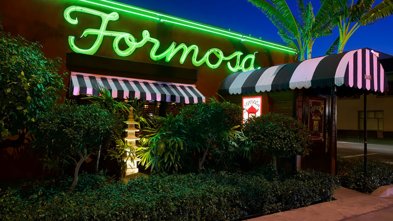 Exterior of Formosa Cafe in West Hollywood lit up at night