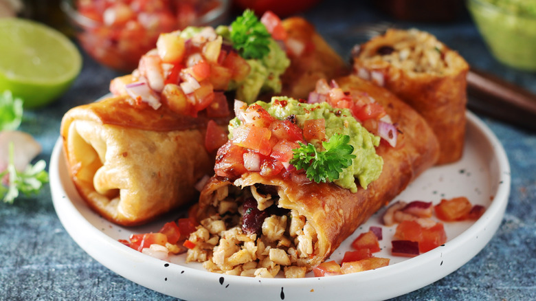 Chimichangas on a plate.