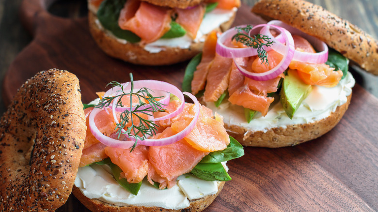Bagels topped with salmon, onion, and cream cheese