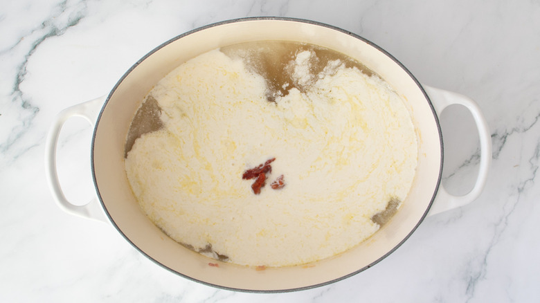 pot filled with white and clear liquids