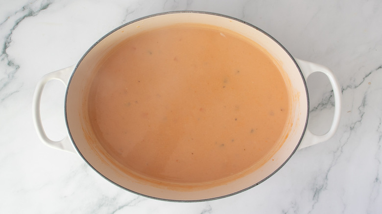 pinkish soup in a pot
