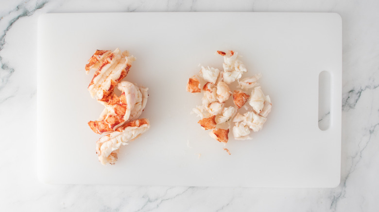 lobster meat on a white plastic board