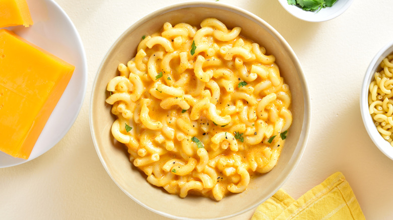 A white bowl filled with macaroni and cheese