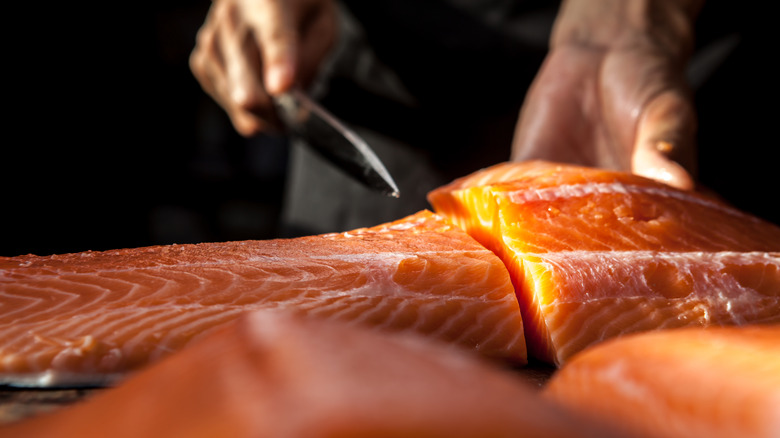 chef slicing salmon