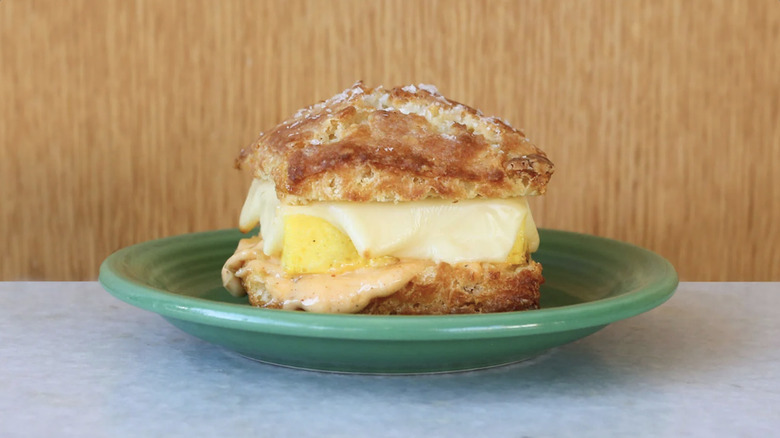 a biscuit sandwich with egg cheese and pimento mayo