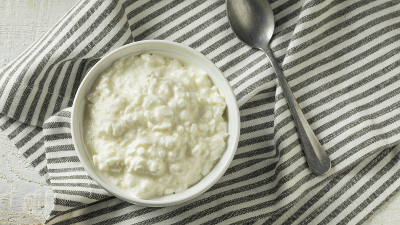 cottage cheese in a bowl on a tea towel
