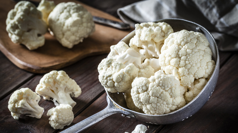 cauliflower in a metal ladle