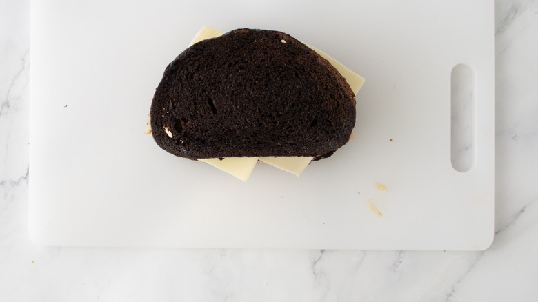 aerial view of stacked reuben sandwich on cutting board