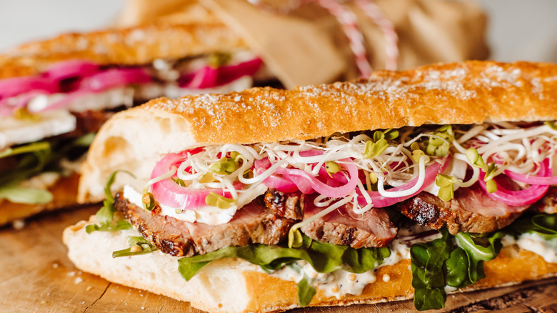 closeup of sandwich with arugula and meat