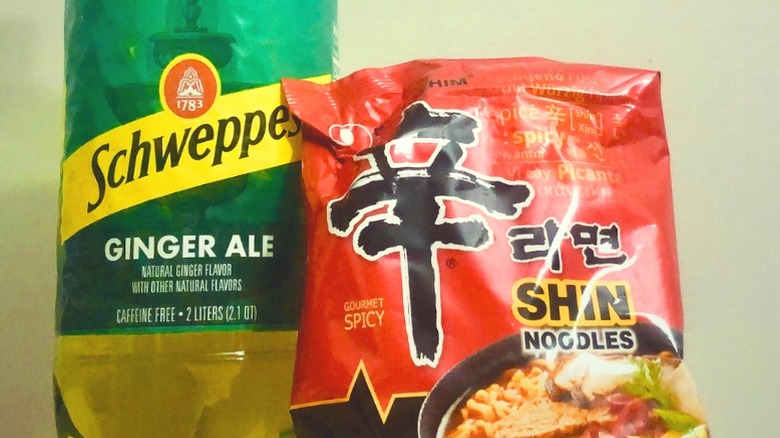 Ginger ale bottle and instant ramen pack