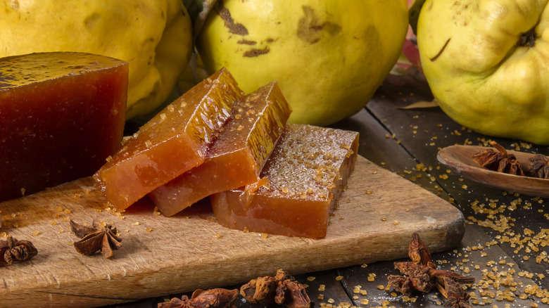 Quince paste slices on a wooden board.