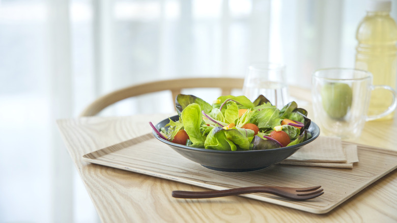 Bagged salad in a bowl at the dining table