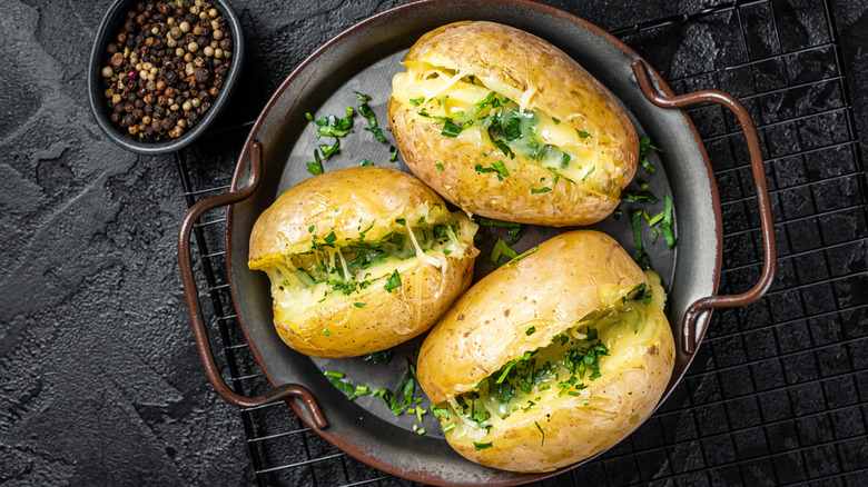 Plate of baked potatoes.
