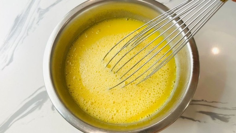 Egg yolk mixture and whisk in bowl