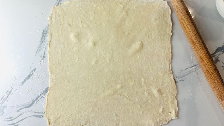 Pastry dough rolled out into square
