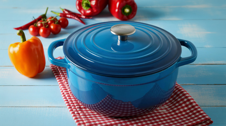 blue enameled dutch oven on a tea towel