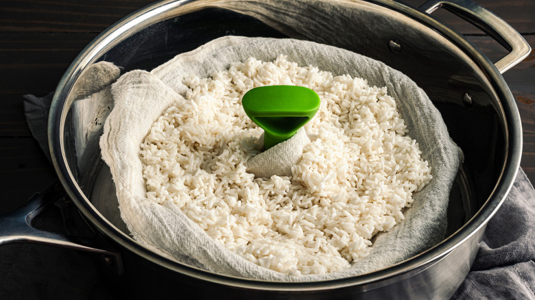 stovetop steamer with steamed rice inside