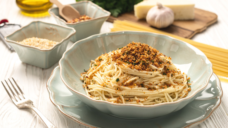 A bowl of pasta with breadcrumbs