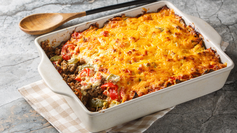 Taco bake in casserole dish over a napkin