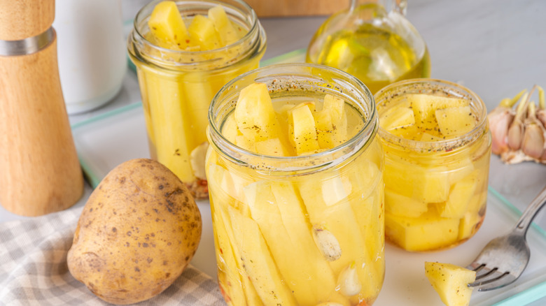 jars of canned potatoes on a table