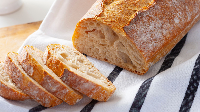 Sourdough loaf and slices with a nice, golden exterior