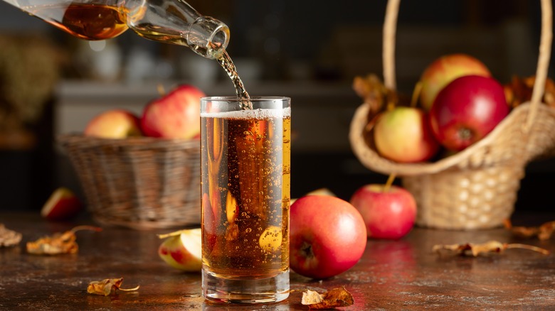 apple cider pouring into glas