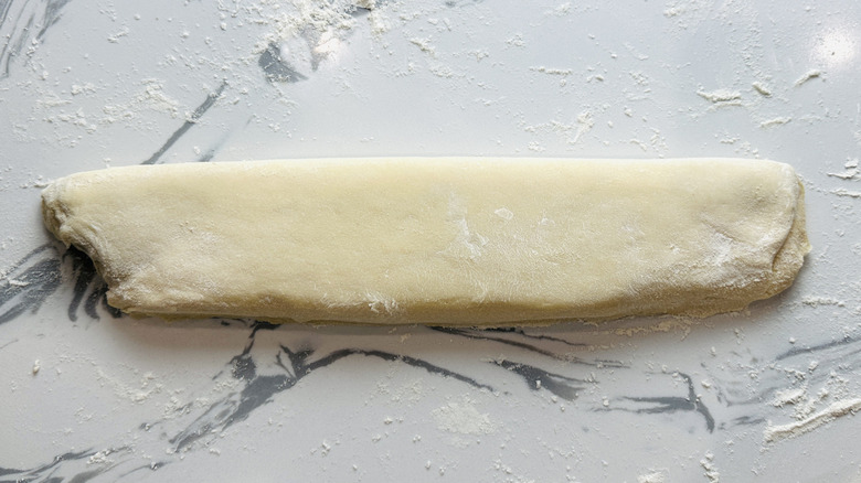 rectangle of bread dough on a kitchen counter