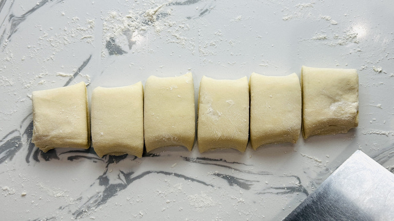 segments of bread dough on a kitchen counter