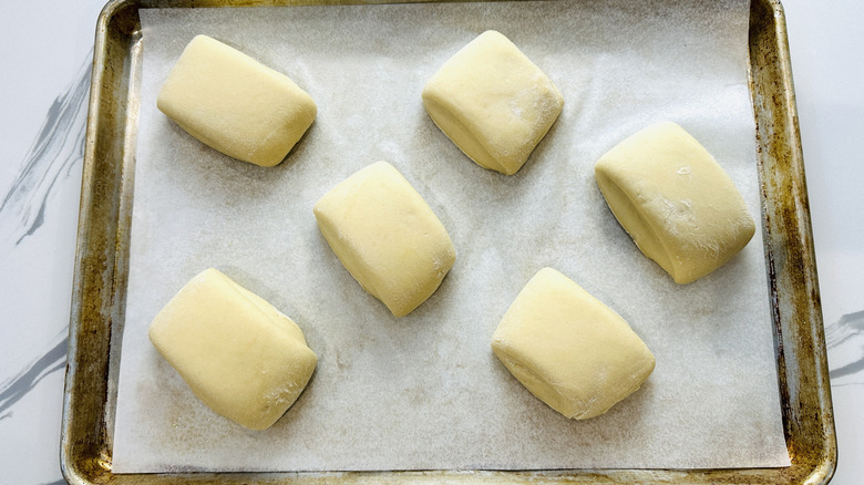 small rectangles of bread dough in a baking pan