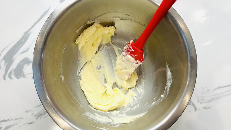 softened butter in a metal bowl