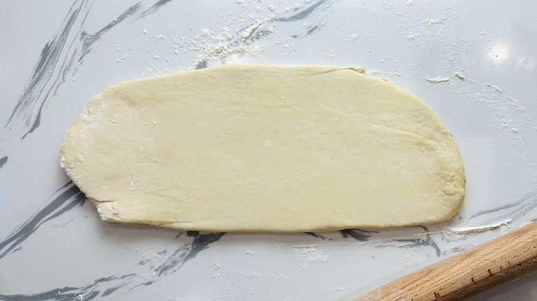 oval of bread dough on a kitchen counter