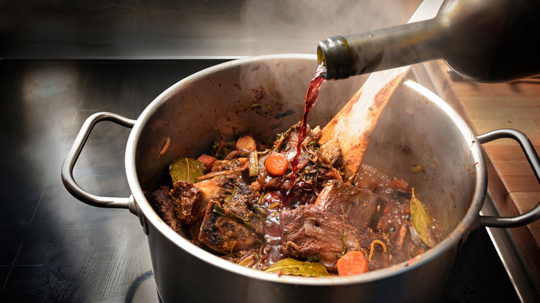 Pouring wine into pot roast