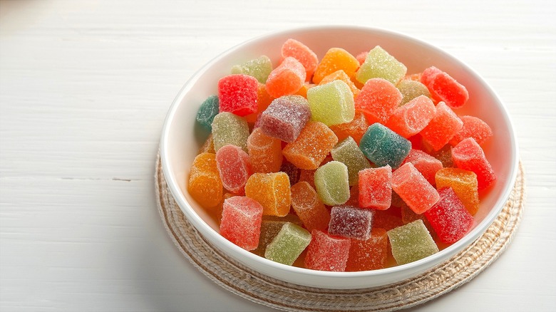 Bowl of colorful homemade gummy candies covered in sugar