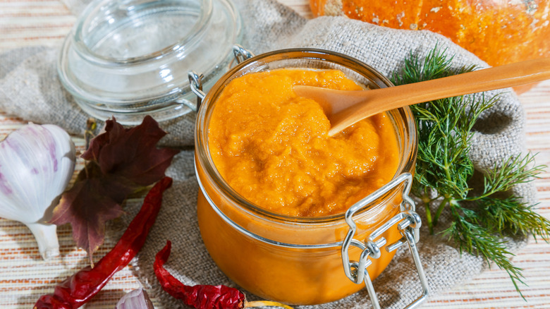 a glass jar full of pumpkin puree