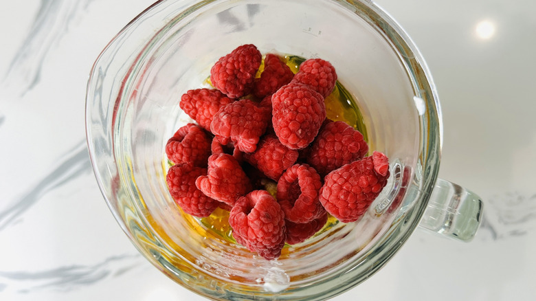 Raspberries and honey in blender