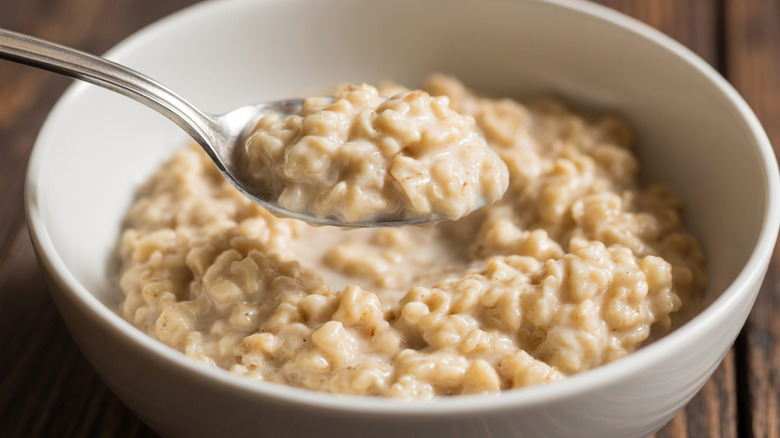 creamy plain oatmeal in a ceramic bowl