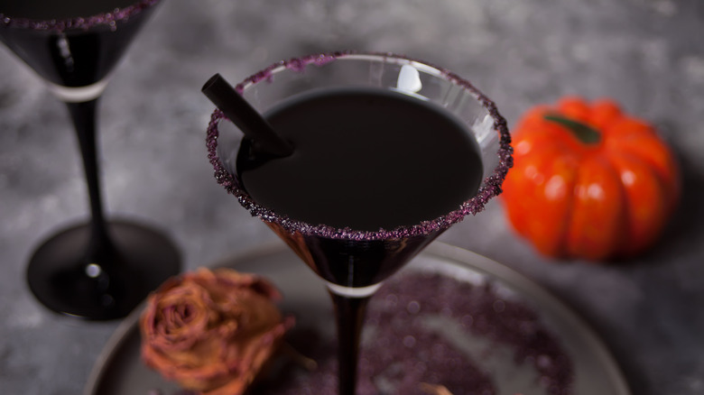 black martini with purple sugar rim